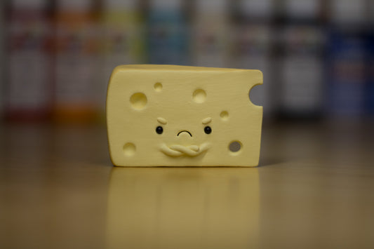 Grumpy Swiss Cheese Slice Figurine