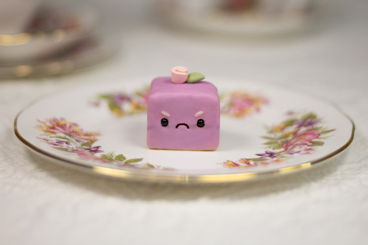 Grumpy Purple Petit Four Figurine