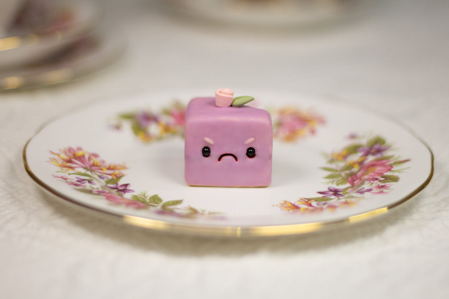 Grumpy Purple Petit Four Figurine