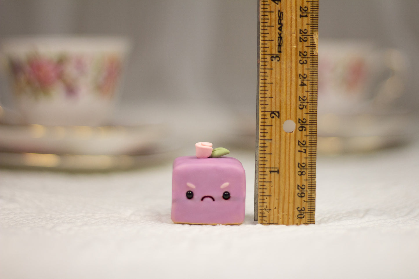 Grumpy Purple Petit Four Figurine